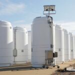 The High Burnup Research Cask (center) stands with other spent nuclear fuel dry storage casks at North Anna Power Station in Virginia. Dominion Energy